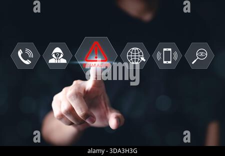 Cybersecurity scam alert warning concept. A hand interacts with a virtual interface displaying icons for scam alert, fraud detection, Stock Photo