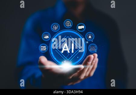 Artificial Intelligence (AI) and Business Support Concept. A person holds AI icons, data processing, communication, security, automation, role Stock Photo