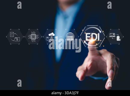 EDI, Electronic Data Interchange Concept. Businessman touching on EDI (Electronic Data Interchange) icons, global data transfer, digital security, Stock Photo