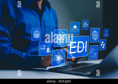 EDI, Electronic Data Interchange Concept. Businessman working on EDI (Electronic Data Interchange) icons, global data transfer, digital security, info Stock Photo