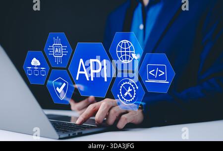 API Application Programming Interface Concept. A programmer types on a laptop, interacting with digital icons representing API development, security, Stock Photo
