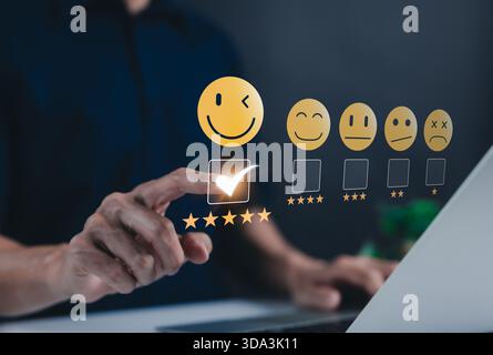 Customer review satisfaction feedback survey concept. A user selects five star rating on a virtual interface, showcasing customer satisfaction, Stock Photo