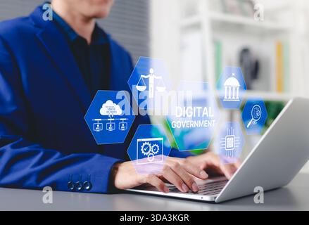 Digital government and E-governance concept. Businessman using laptop with icons e-governance, cloud computing, legal balance, government institutions Stock Photo