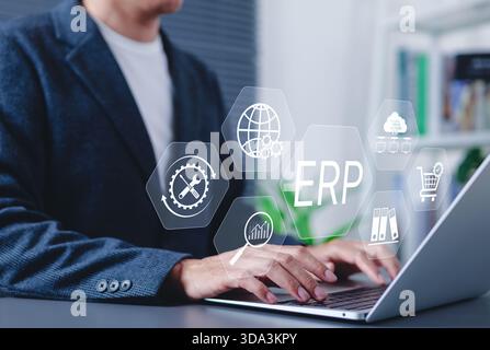 ERP Enterprise Resource Planning system concept. Businessman using laptop with digital interface ERP (Enterprise Resource Planning) icons, Stock Photo