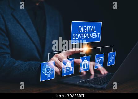 Digital government and e-governance concept. Business professional using laptop with digital government icons, representing e-governance, Stock Photo