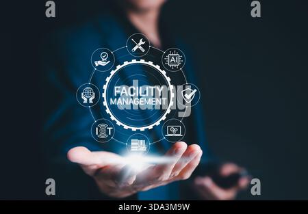 Facility Management Digital Transformation Concept. Business professional presents futuristic facility management system Stock Photo