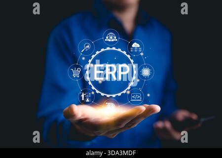 ERP - Enterprise Resource Planning Concept. Business professional presenting ERP system icons representing enterprise resource planning, data Stock Photo