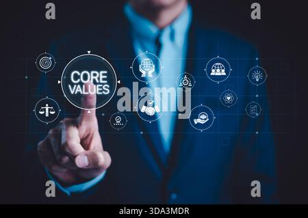 Business Core Values and Organizational Principles Concept. Businessman pointing virtual core values such as integrity, teamwork, accountability, Stock Photo