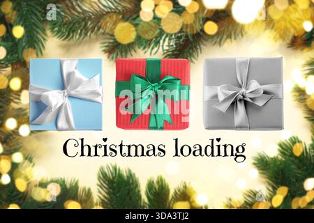 Christmas loading, expectation of holiday. Gift boxes on blurred background with fir tree branches and bokeh lights Stock Photo