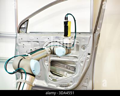 Robotic arm with 3D vision systems car door automotive industry Stock Photo