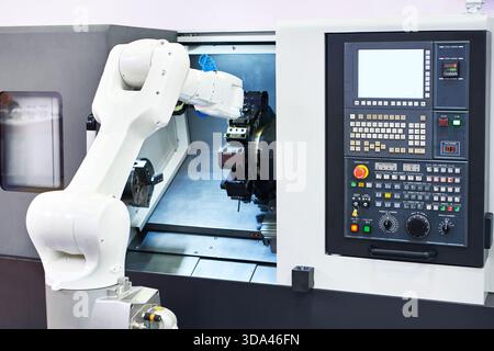 Universal industrial robotic arm and cnc lathe machine Stock Photo