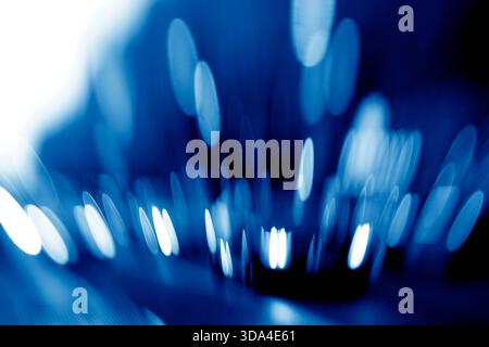 Abstract background with blurred blue lights creating oval shapes Stock Photo