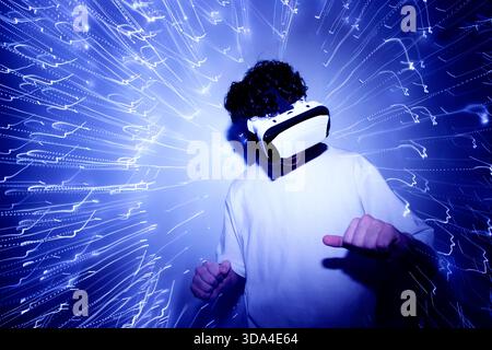 person with virtual reality goggles and lights Stock Photo