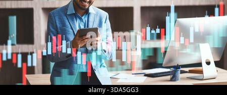 Cheerful Indian Businessman Using Digital Tablet in Modern Office Environment During Work Hours Stock Photo