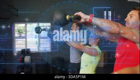 Swinging three adults wearing red grey yellow tops, doing kettlebell presses in gym with blue HUD Stock Photo