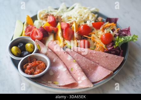 Fresh salad and deli platter at a restaurant lunch Stock Photo