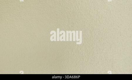Close-up Background Texture of Light Beige Cream Painted Stucco Wall Stock Photo