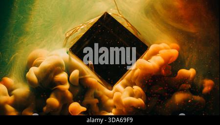 Art glass cube. Haze color wave. Orange green paint defocused cloud flow on garland light. Abstract liquid sparkling particles color background. Stock Photo