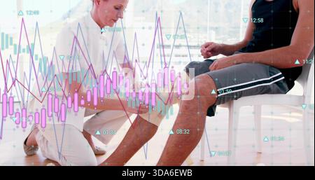 Kneeling clinician taping patient's knee in clinic, white uniform black tank gray shorts charts Stock Photo