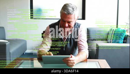 Holding senior man wearing pink striped shirt, dark vest, checking tablet in lounge, code overlay Stock Photo