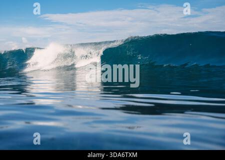 Ocean blue wave. Crashing surfing wave Stock Photo