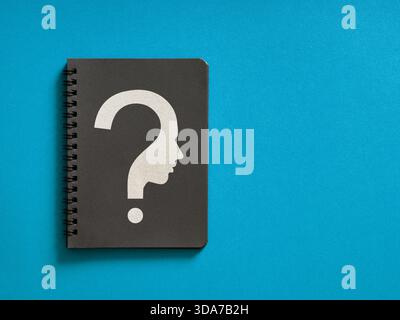 Brainstorming ideas, uncertainty, suspicion, problem solving, and psychological concepts displayed on a notebook cover Stock Photo
