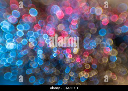 Christmas background with bokeh, Abstract bokeh light on black background different colors Stock Photo