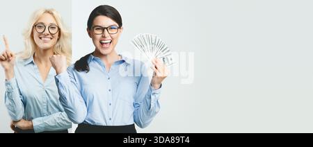 Group of Excited Business People Celebrating Success With Cash in a Bright Office Setting Stock Photo