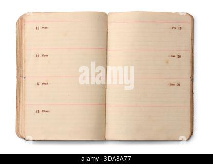 top view of open antique notebook with yellowed pages, weekly schedule layout from monday to sunday isolated white background, vintage stationery Stock Photo