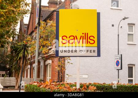 LONDON - NOVEMBER 7, 2025: Parsons Green Fulham – Savills estate agent "Under Offer" board outside Victorian terraced house in autumn residential stre Stock Photo