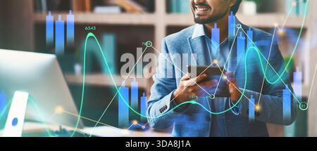Happy Indian Programmer Works With Tablet in Modern Office Space During Work Hours Stock Photo