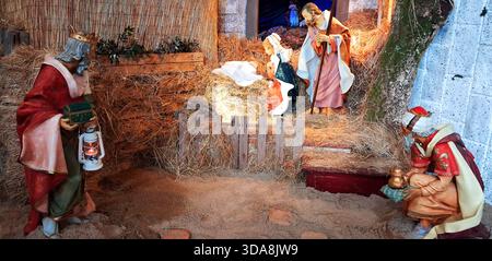 Serene nativity scene, with Mary and Joseph gazing tenderly at baby ...