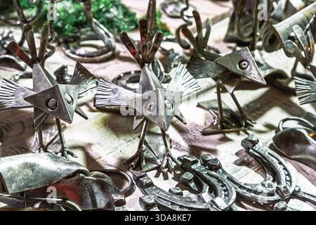 Handmade metal products from a blacksmith are on display at the New Year fair on Red Square near GUM. Horseshoes Stock Photo