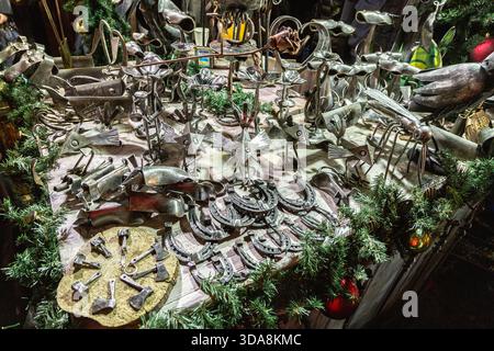 Handmade metal products from a blacksmith are on display at the New Year fair on Red Square near GUM. Horseshoes Stock Photo