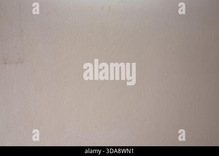 Beige textured wall background with subtle grain pattern for clean minimalist design projects Stock Photo