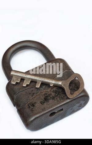 Rusty Old Padlock with Key, Isolated on White Background Stock Photo