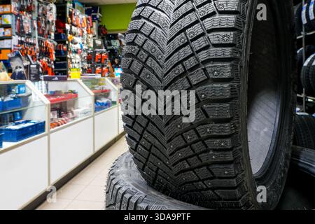 winter-tire-replacement-for-suv-with-studded-wheel-in-service-bay