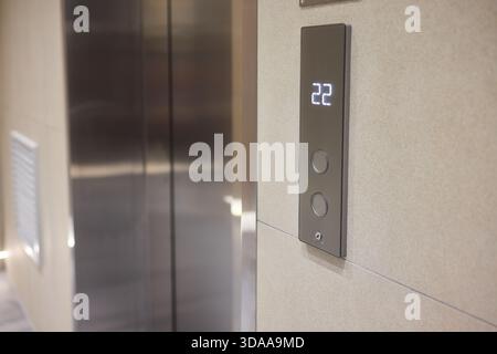 High-tech elevator panel featuring tactile buttons and illuminated screen, Advanced elevator interface showcasing touch sensitive controls alongside Stock Photo