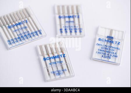 Mainz, Germany - Dec 09, 2025: Different needle packs of the brand Schmetz for sewing displayed on a white surface. Stock Photo