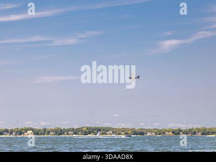 large us military plane flying low over the north fork of long island, ny Stock Photo