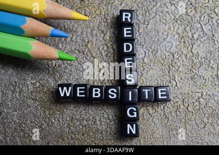 Concept of website redesign words arranged with on wooden letter blocks. Stock Photo