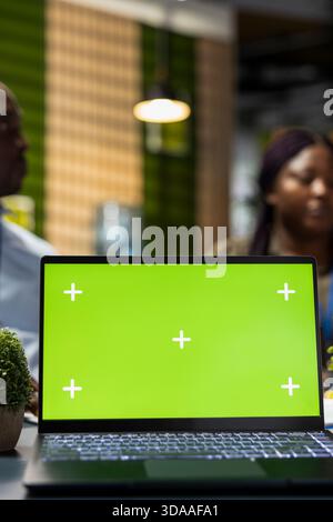 Isolated screen laptop used by admins in Silicon Valley office developing software apps. Chroma key notebook used by IT professionals to code, debugging applications to resolve issues, close up Stock Photo