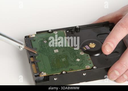 Soldering iron in his hand on a white background Stock Photo