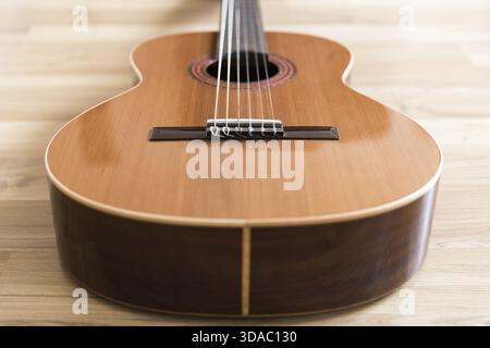 A classical guitar with six nylon strings Stock Photo