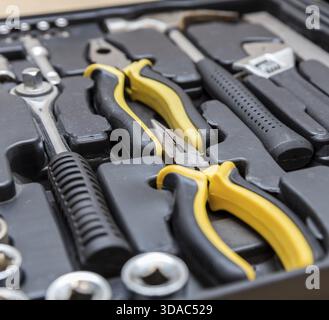 Toolbox set of tools include hammer wrench bit driver pliers hex key bush level hex key Stock Photo