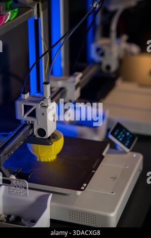 A student man print prototype on 3D printer Stock Photo