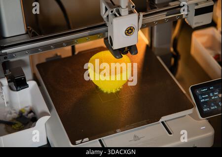A student man print prototype on 3D printer Stock Photo