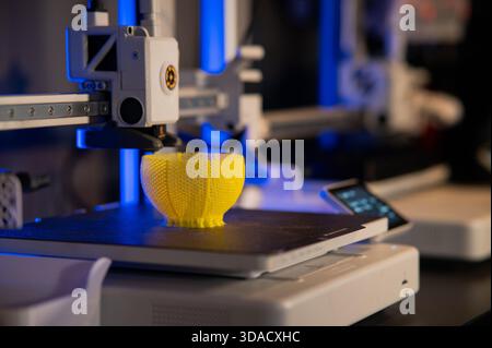 A student man print prototype on 3D printer Stock Photo