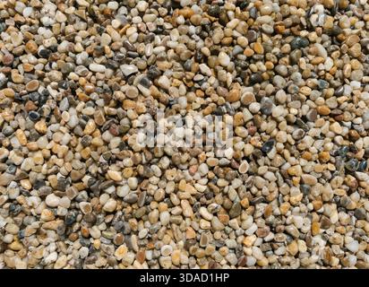 Even surface of small pebbles viewed from above. Background texture Stock Photo