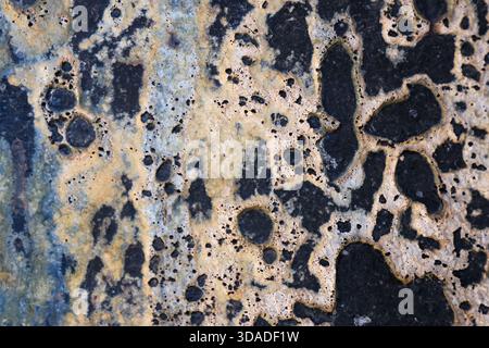 Intriguing abstract background texture showing grunge pattern of decay and corrosion. old, rough surface has pitted, rustic and weathered appearance Stock Photo